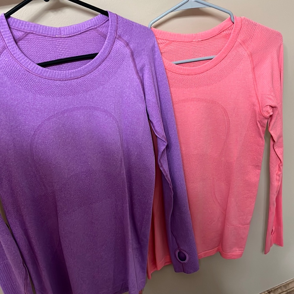 Two long sleeve lululemon shirts. Purple and salmon pink.
